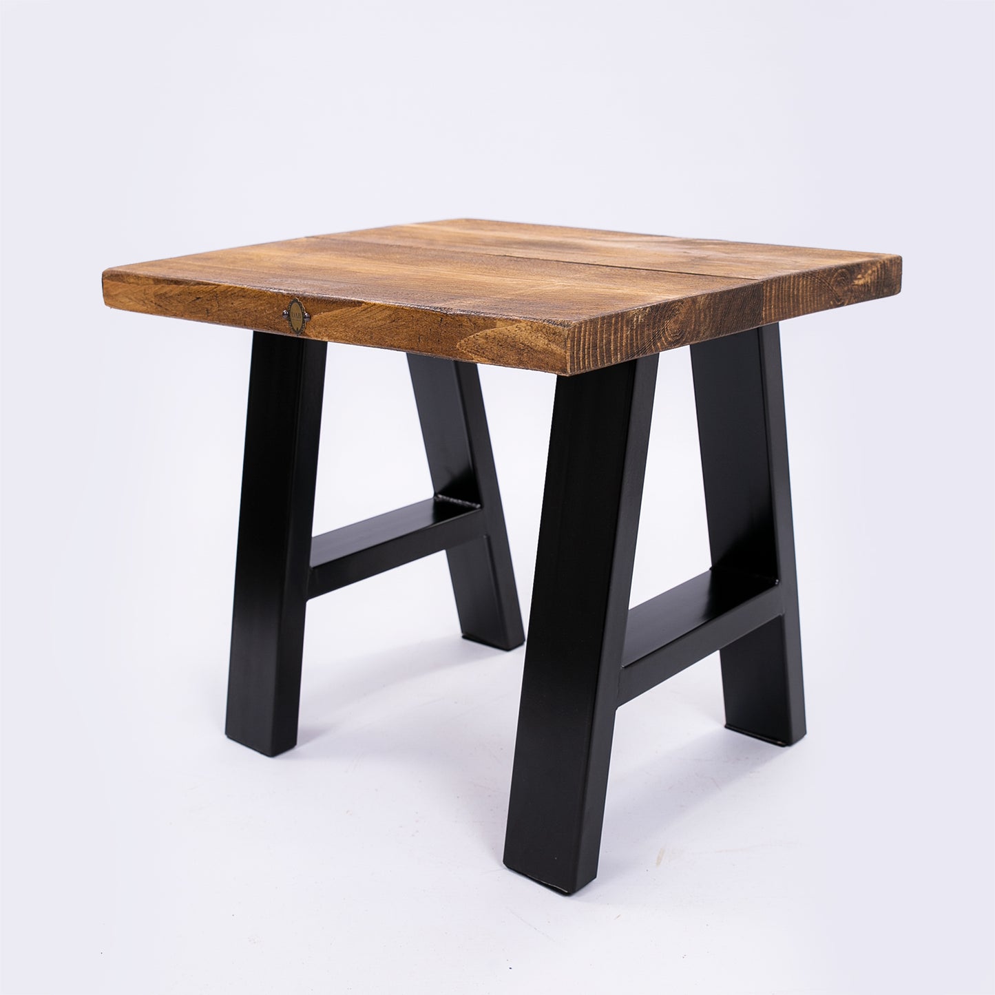 Handmade solid wooden stool with steel legs. Corner angle photo