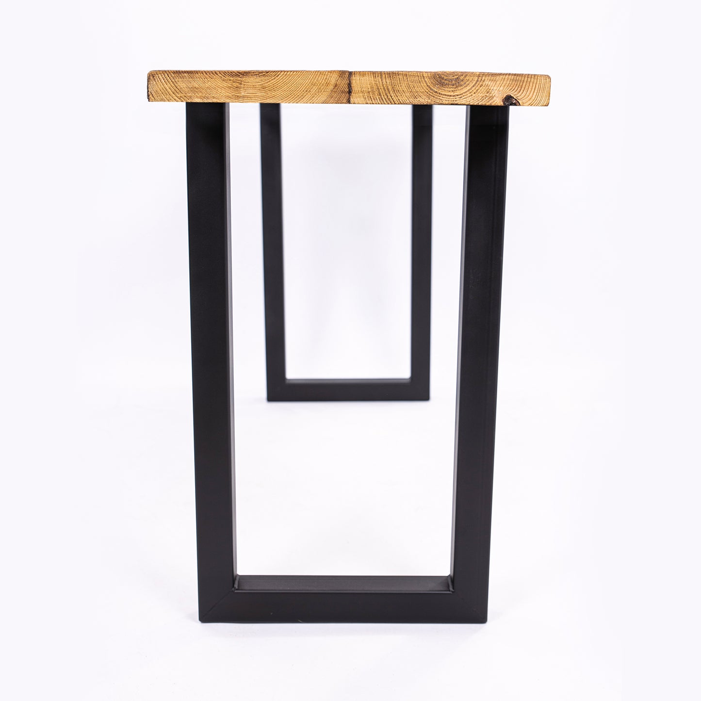 Handmade Wooden Table with Black Steel Legs. Clever view through the legs