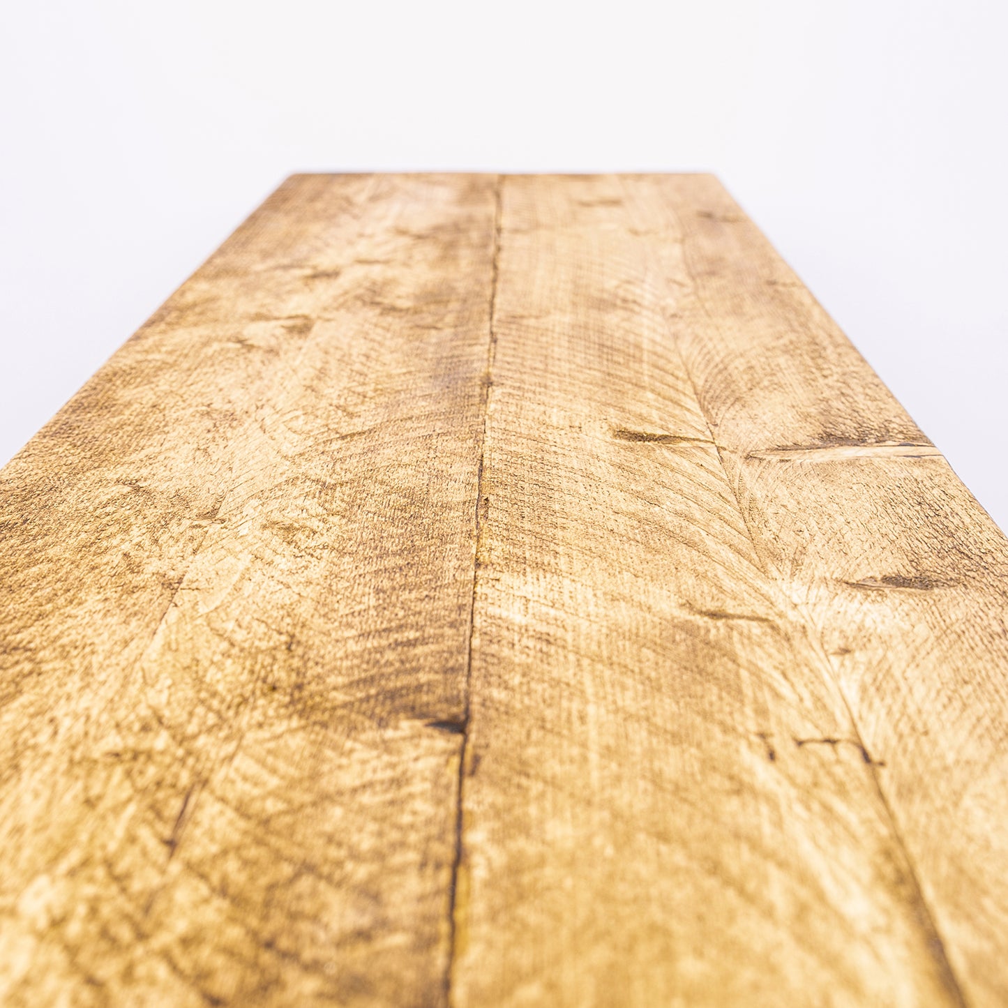Handmade wooden table with black steel legs. Close up of worktop