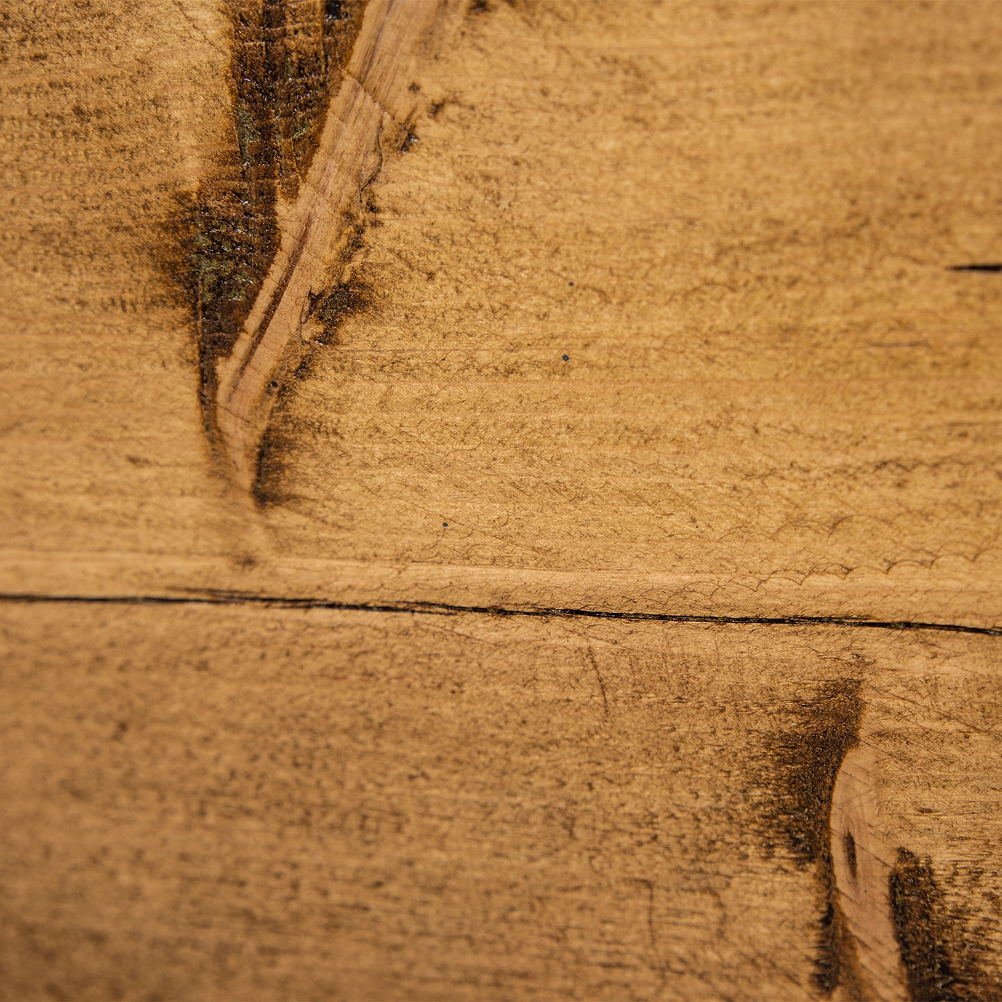 Handmade wooden table with black steel legs. Close up of grain