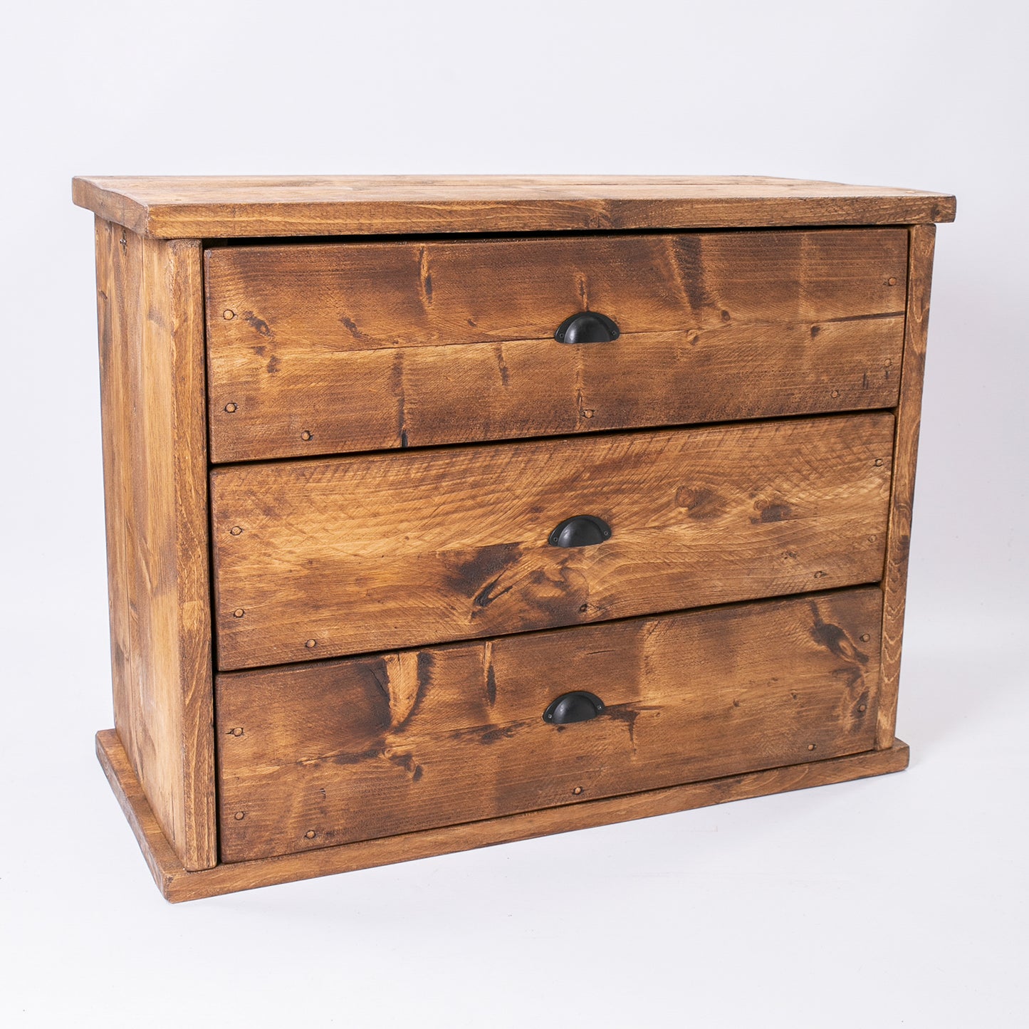 Wooden bedroom drawer set in rustic pine by DAB. Front slightly left side photo.