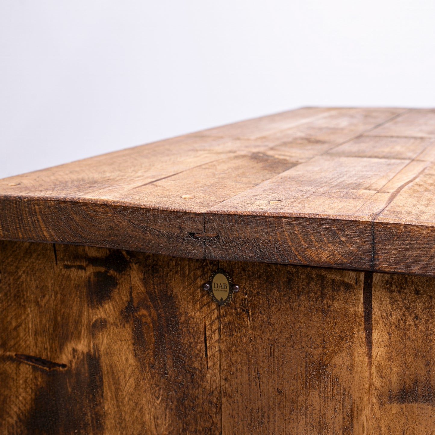 Wooden Bedroom Drawer Set. Close up of top left side showing badge and top