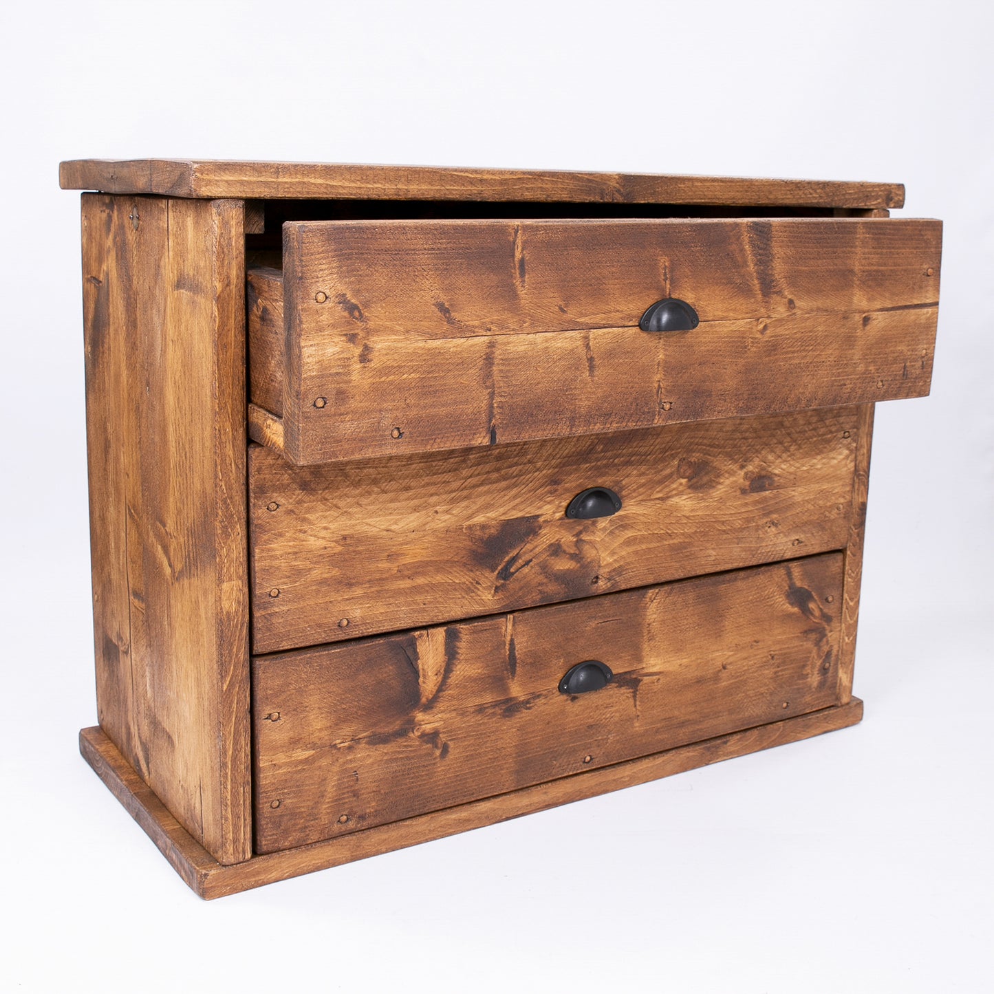Wooden bedroom drawer set with black handles by DAB Chic & Vintage. Drawer open in photo