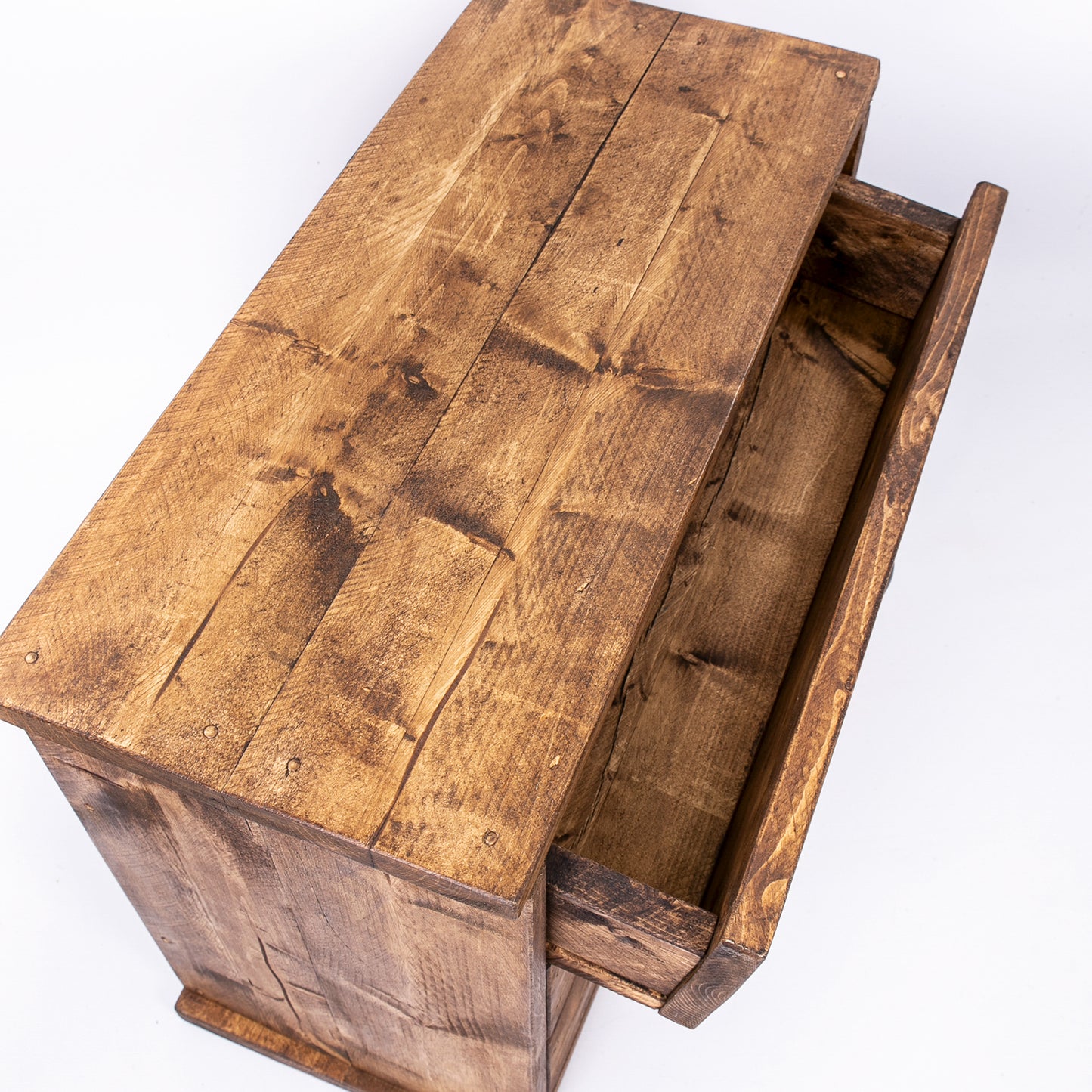 Wooden bedroom drawer set in DAB style rustic wood finish. Birds eye view with drawer open