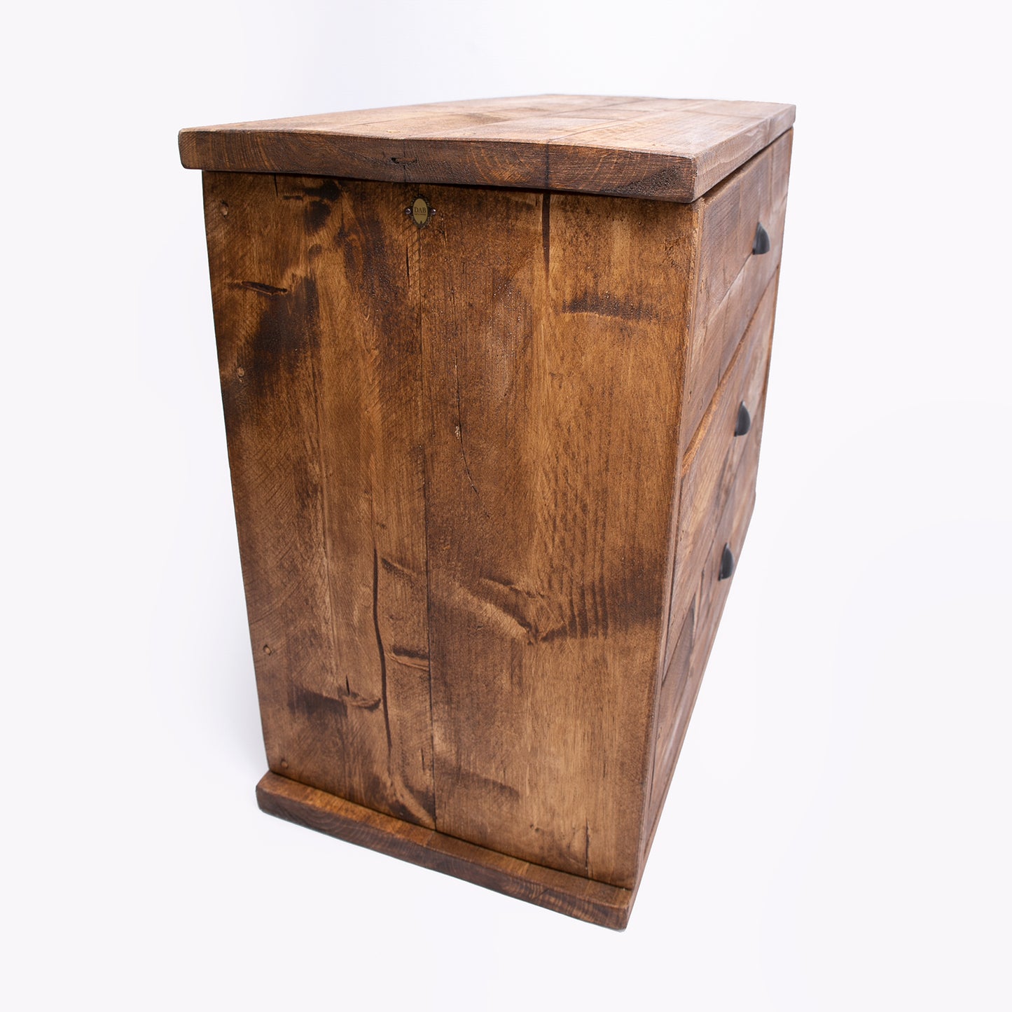 Wooden Drawer Set. Rustic waxed dresser with black handles. Side on view