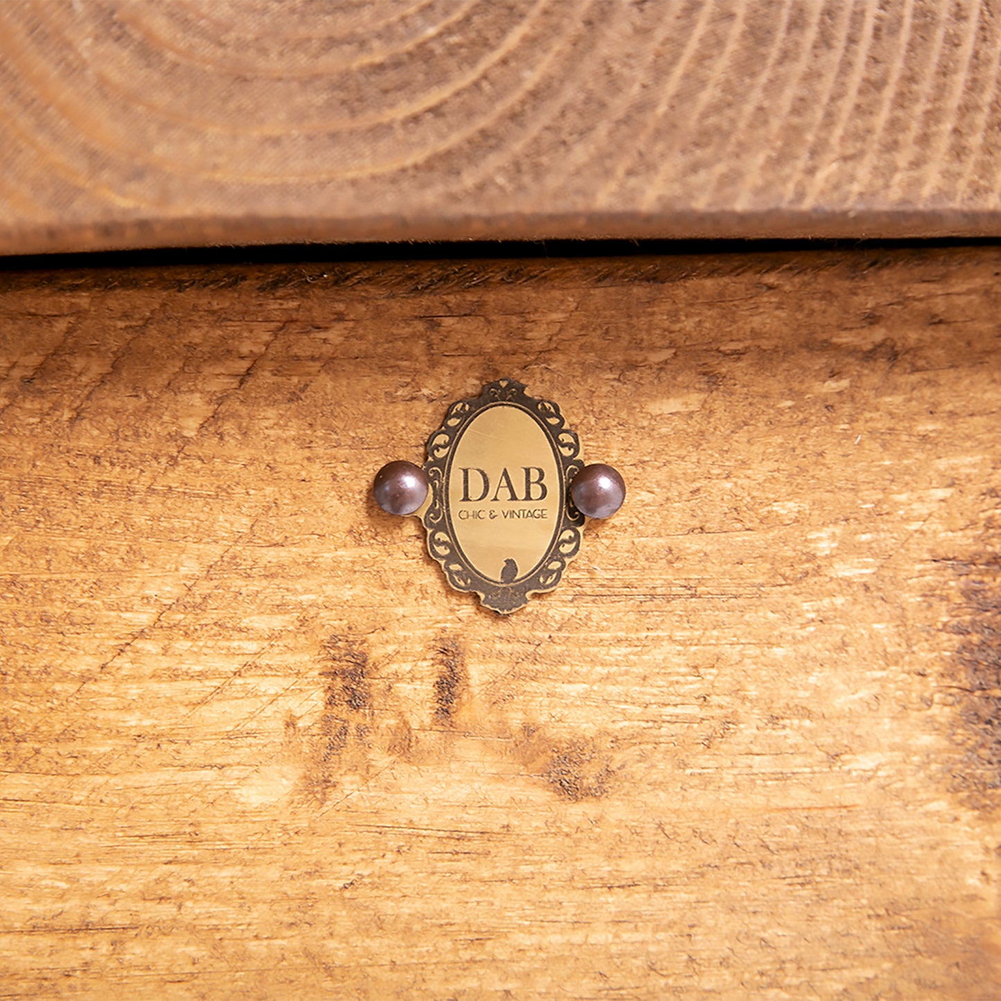 Close up image of DAB Chic & Vintage badge on bespoke trunk.