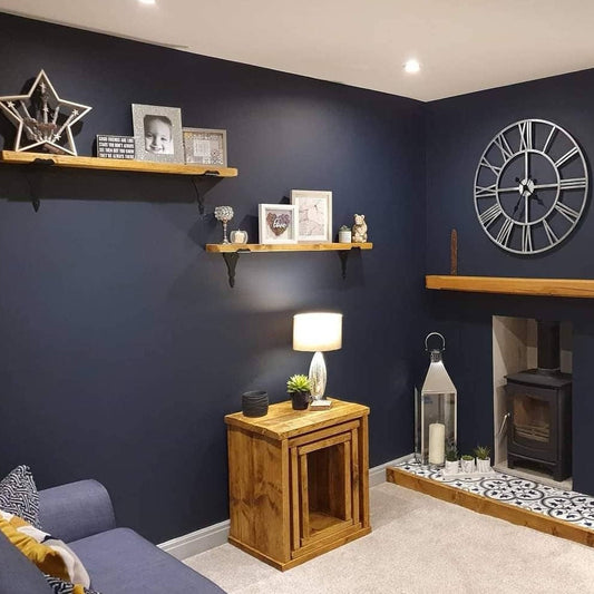 A phot showing an interior living room with DAB interior wooden decor. Handmade in solid woox with antique pine wax. Tables nest set of 3. Also, shelves, mantles made by DAB on show
