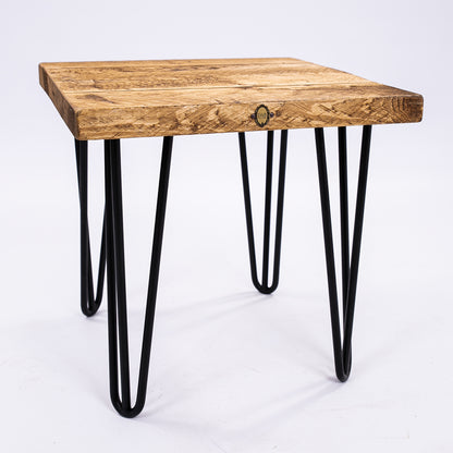 Hairpin legged wooden stool. Slight corner angle view