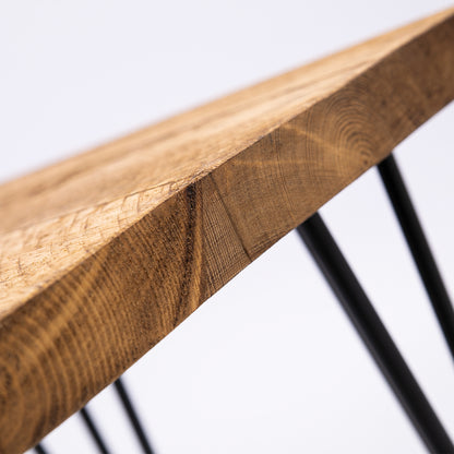 Hairpin legged wooden stool. Close up