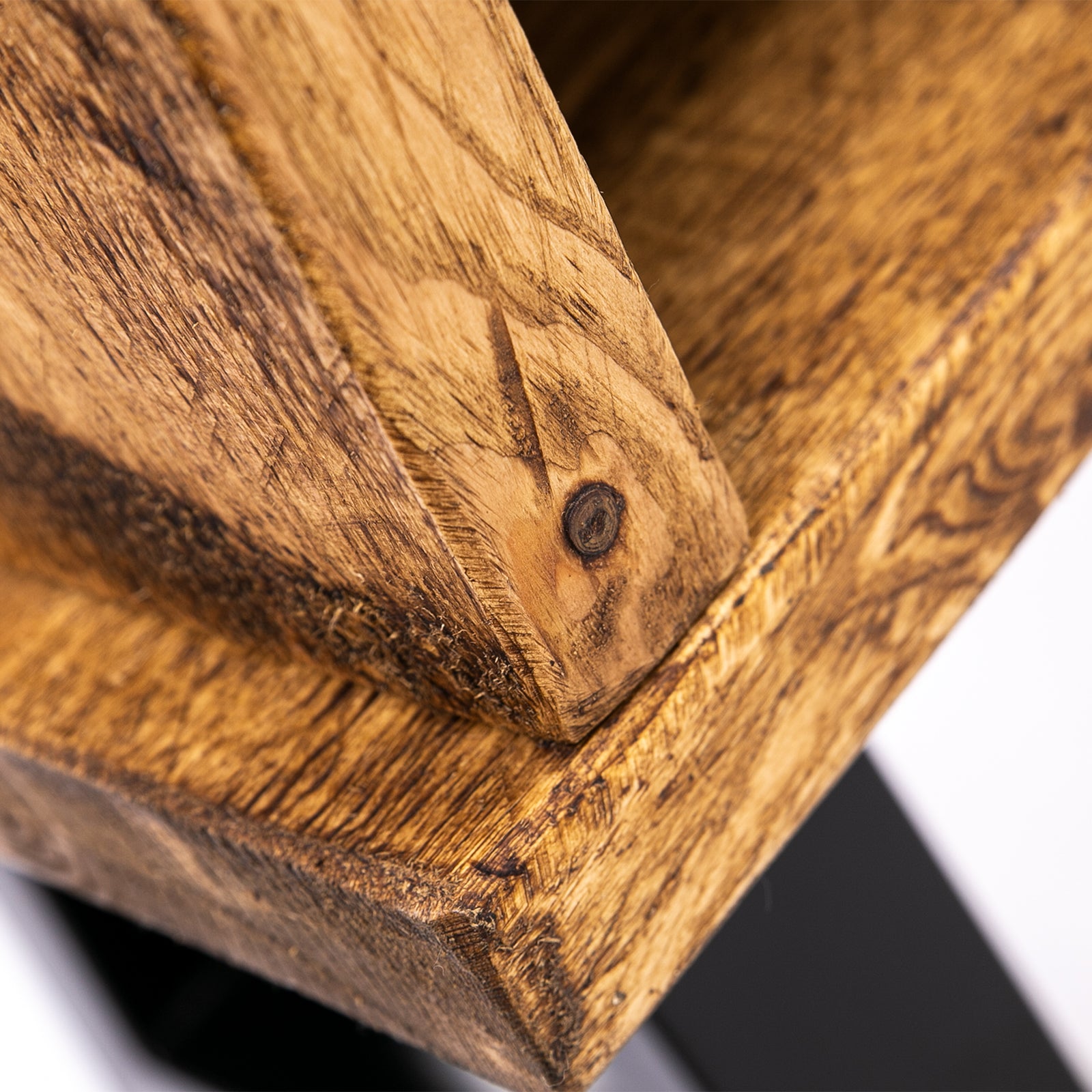 Handmade rustic TV stand with black metal legs. Close up view