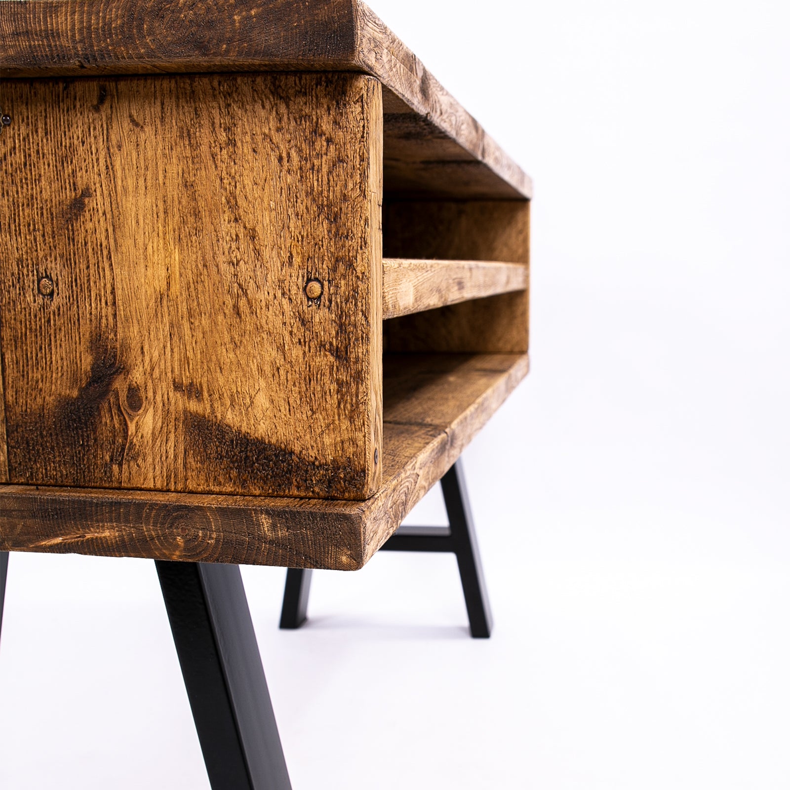 Handmade rustic TV stand with black metal legs. Side close up