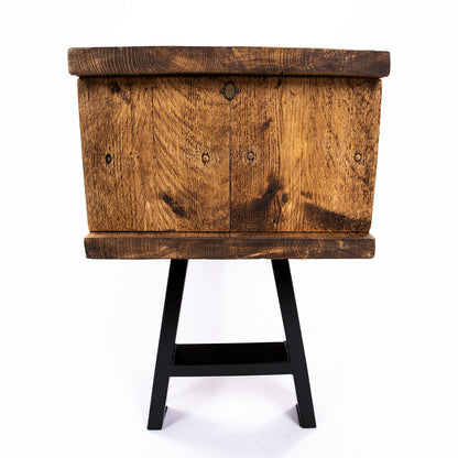 Handmade rustic TV stand with black metal legs. Side on view