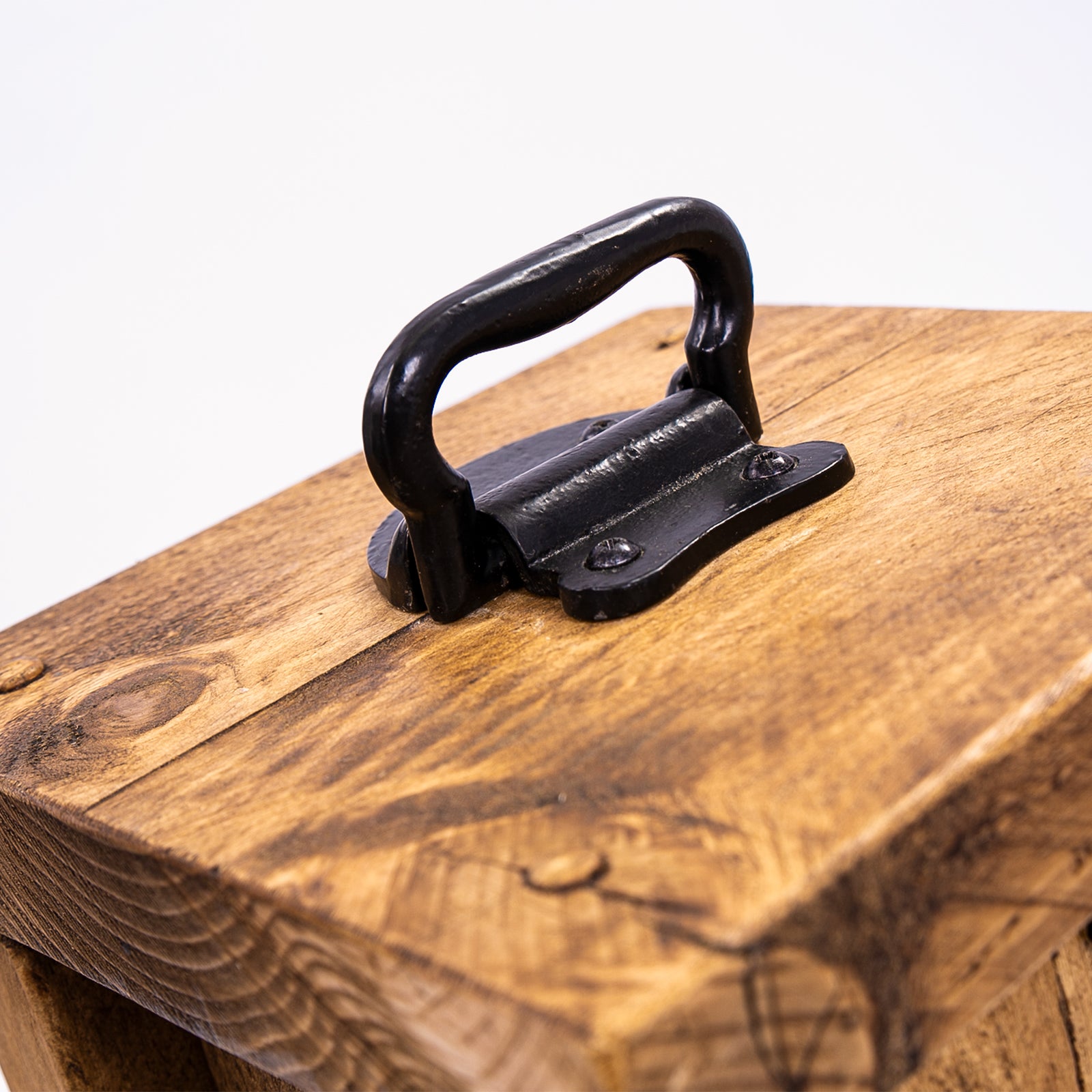 Heavy duty doorstop. Wooden door stopper by DAB. Rustic style. Close up of top and handle