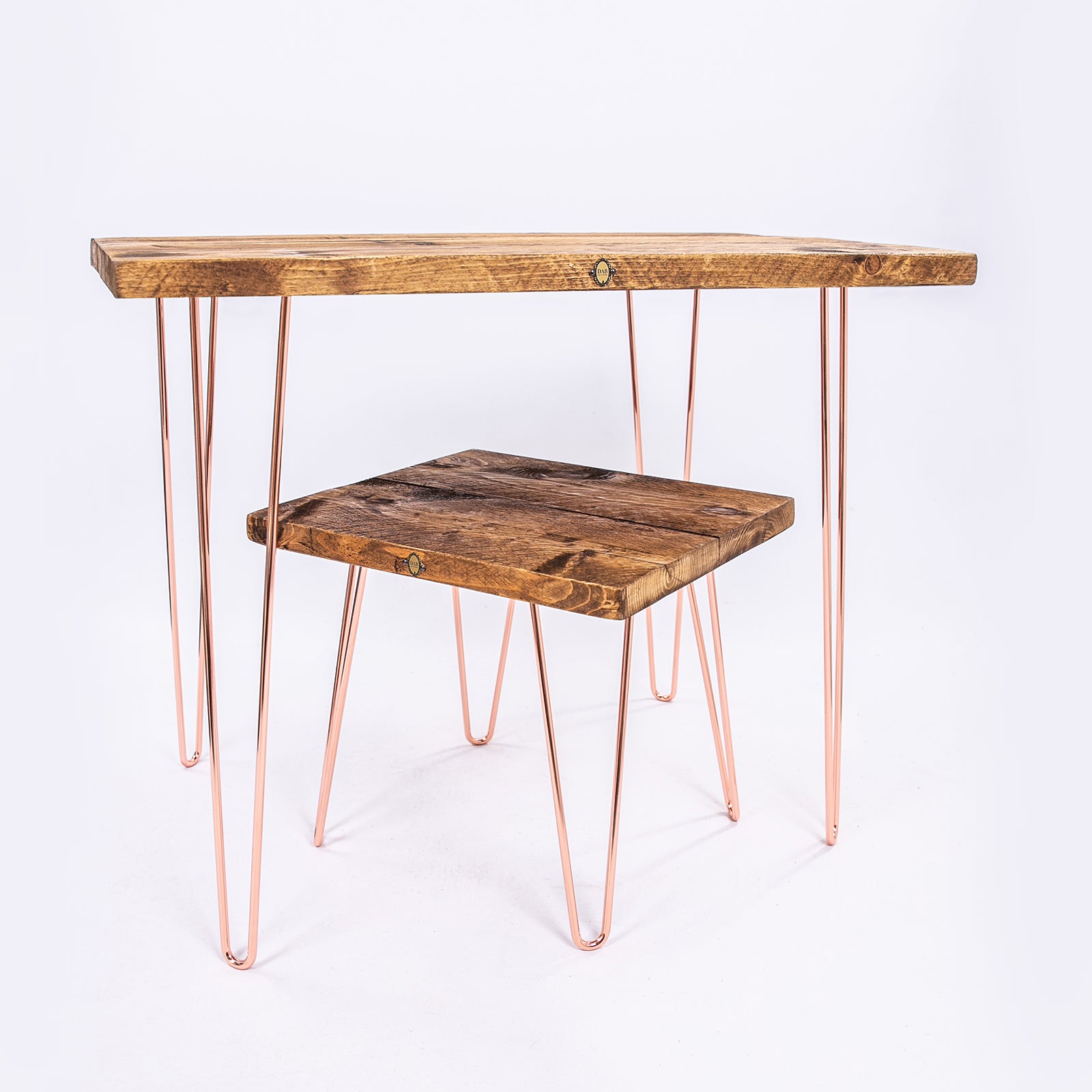 Rose gold desk and seat. Hairpin steel legs and wooden worktops. Side angle view