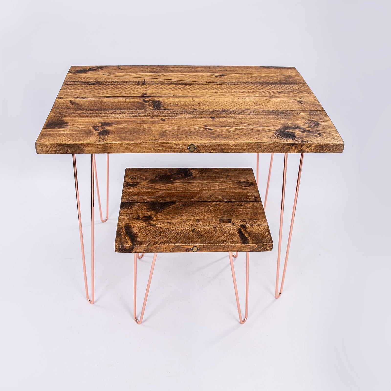 Rose gold work desk seat. Hairpin steel legs and wooden worktops. Front facing view