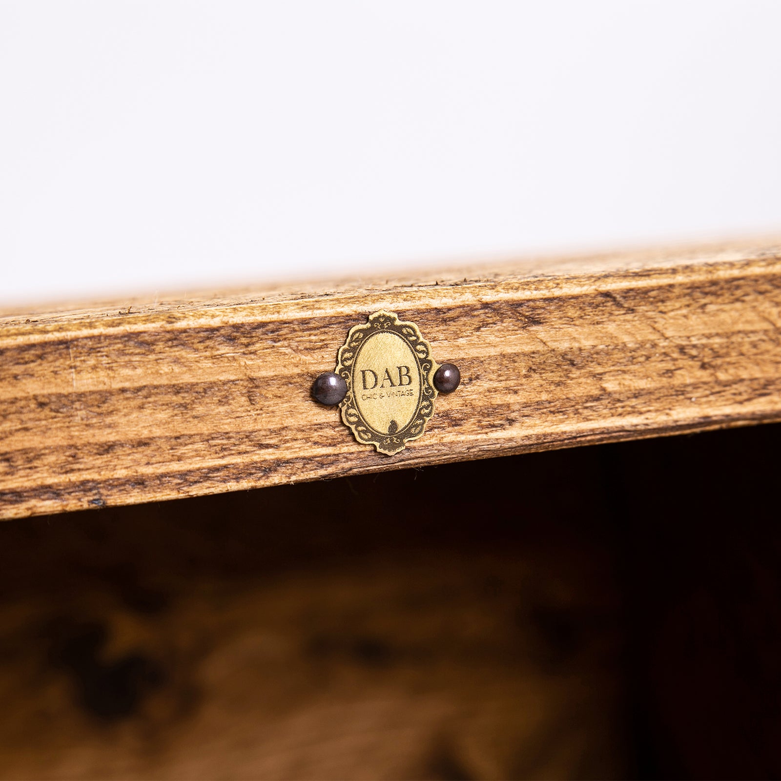 Rustic Wooden Sideboard. Close up of DAB badge on woodwork