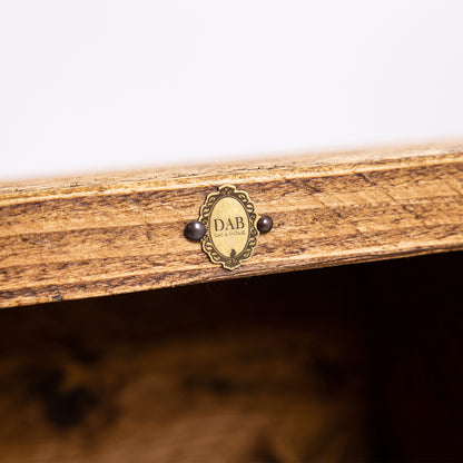 Rustic Wooden Sideboard. Close up of DAB badge on woodwork