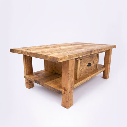 Solid wooden coffee table with drawers. Corner angle view