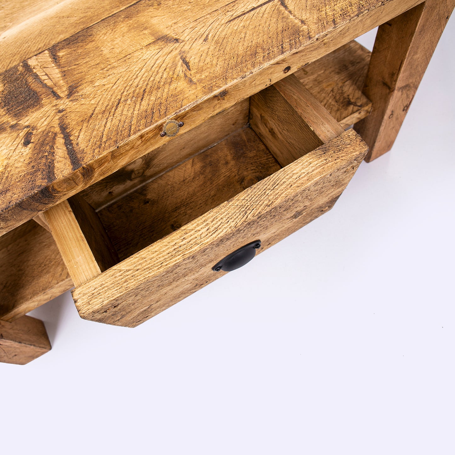 Solid wooden coffee table with drawers. Birds eye view with door open