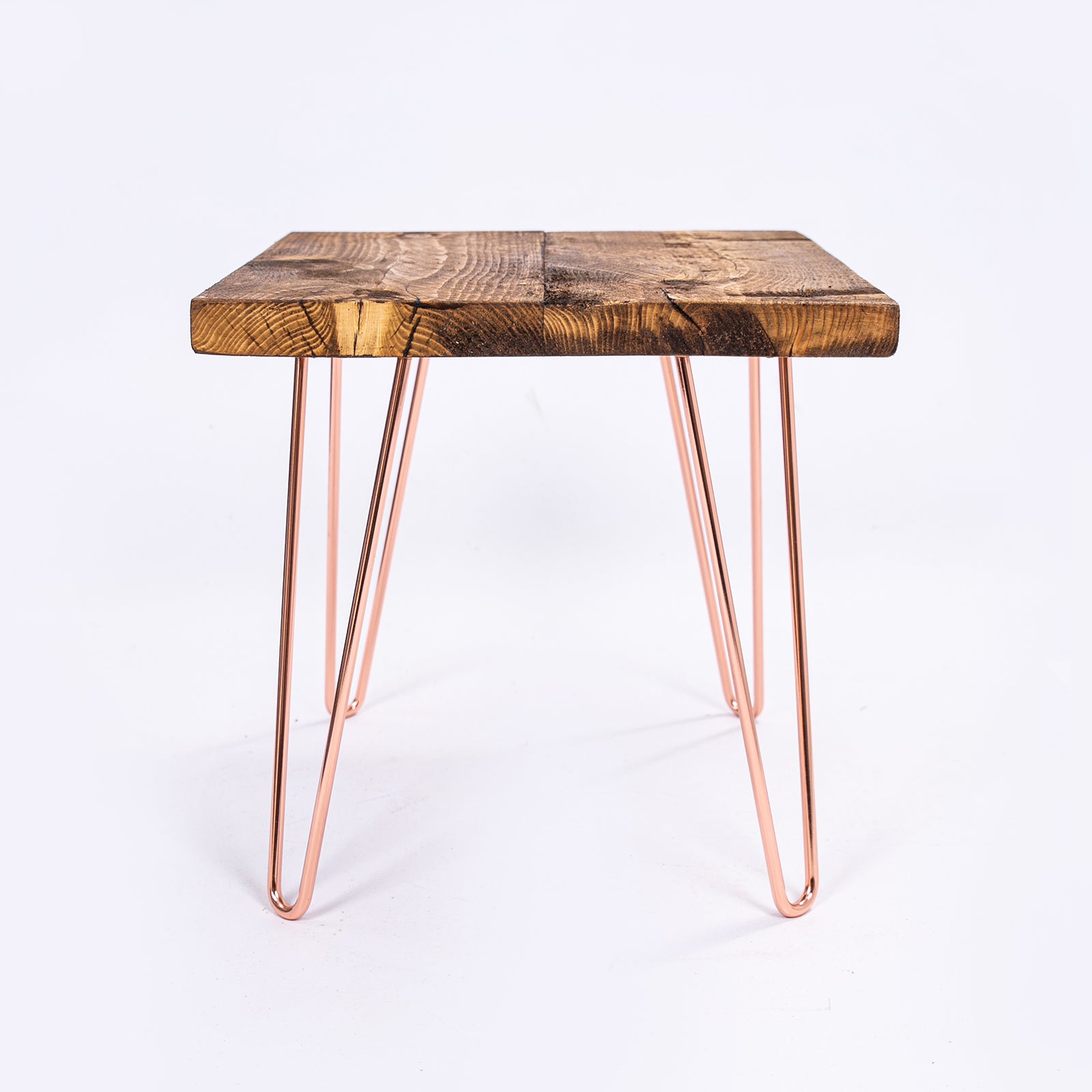 Steel Hairpin Bar Stool with rose gold hairpin legs and wooden top. Side on view