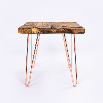 Steel Hairpin Bar Stool with rose gold hairpin legs and wooden top. Side on view