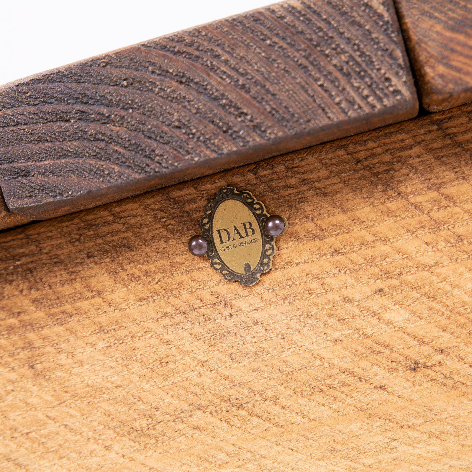 Stylish Blanket Box with Toy Storage. Close up of badge