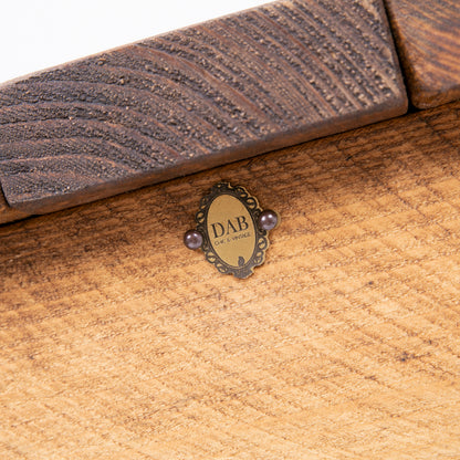 Stylish Blanket Box with Toy Storage. Close up of badge
