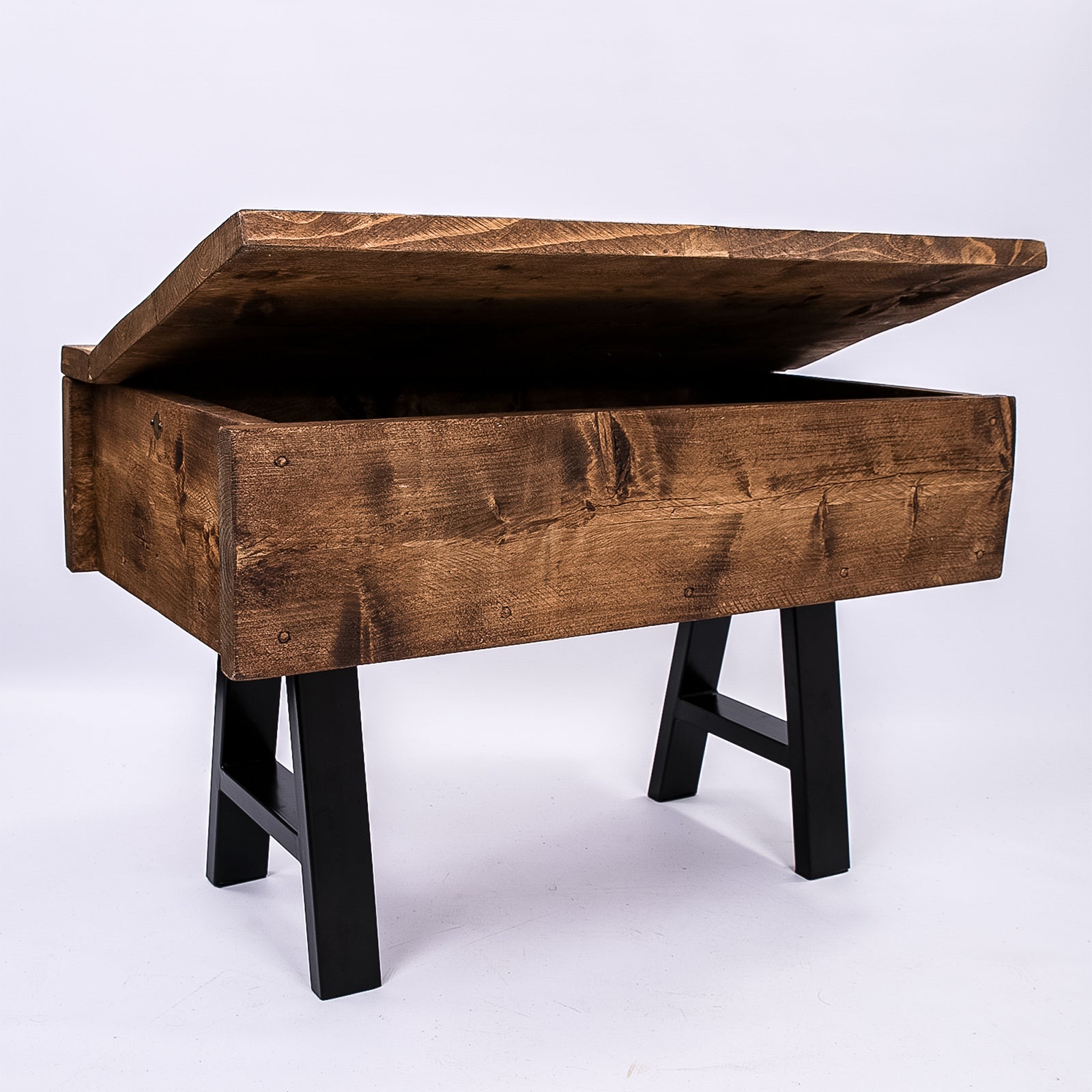 Wooden storage trunk with lid open. Front left photo showing rustic chest with black metal box section legs