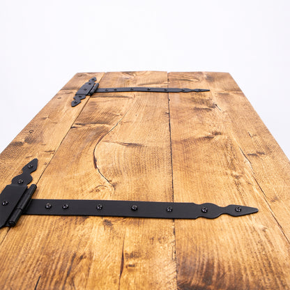 Wooden storage trunk top with black hinges on show